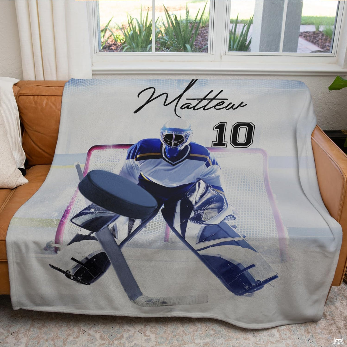Ice hockey goalie sports blanket styled across contemporary bed