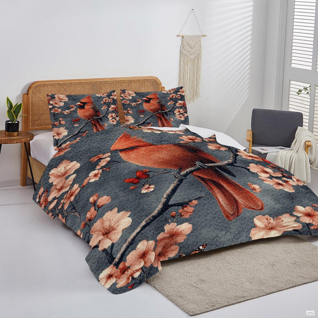 Overhead display of slate grey cardinal bedding arranged neatly over a mattress in a bright bedroom