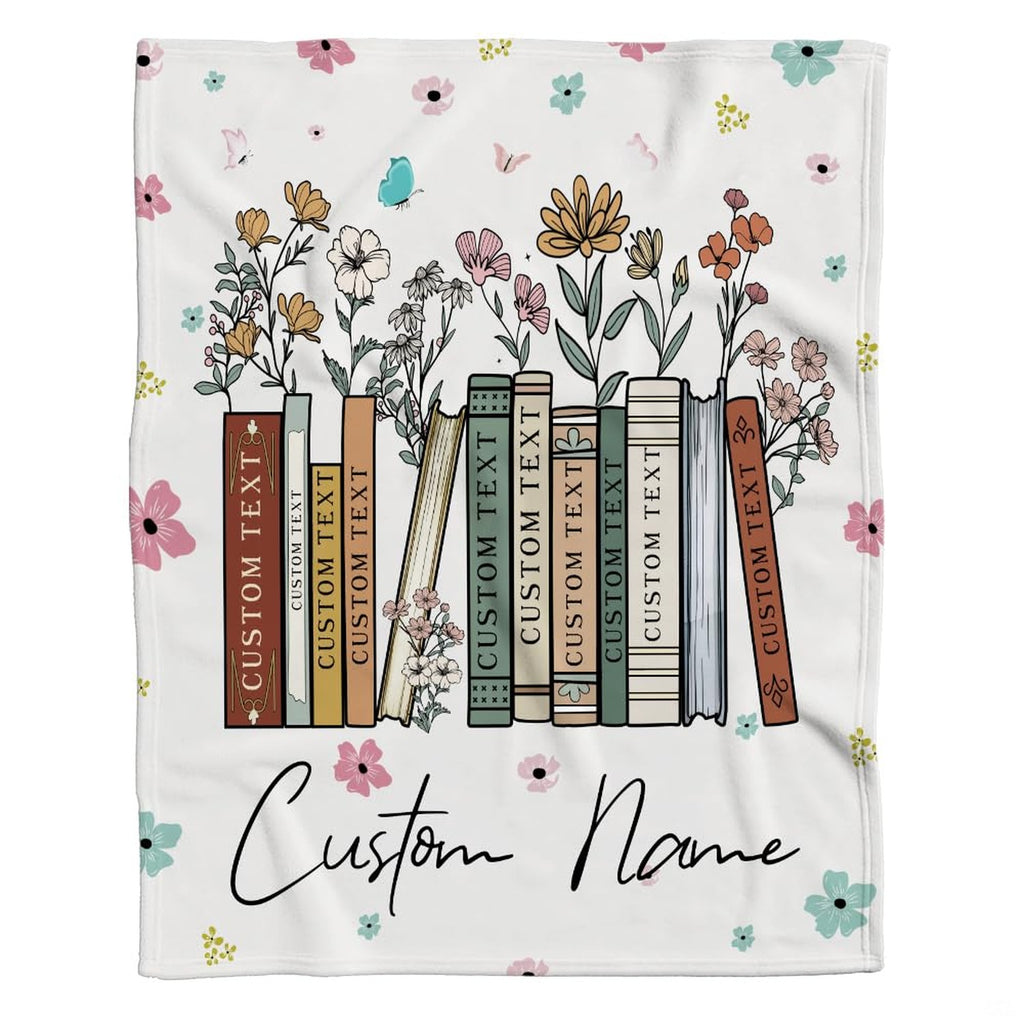 Model displaying the floral book throw blanket in a bright modern home interior.