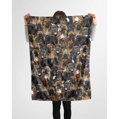 Cane Corso puppy collage blanket styled across a couch in a bright living room.