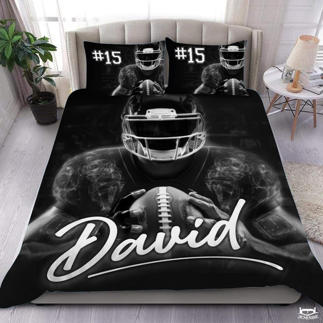 Monochrome football player sports bedding set displayed on tufted bed in modern bedroom.