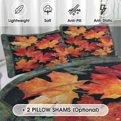 Close-up detail of glowing pumpkin amber and golden honey maple leaves on teal slate autumn bedding