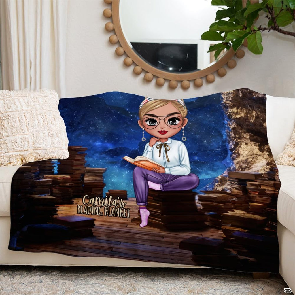 Living room sofa display showing the starry night throw blanket draped neatly beside throw pillows.