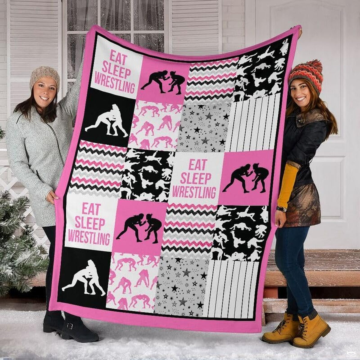 Detail view of neat hemmed edge and high-contrast printing on pink wrestling blanket.