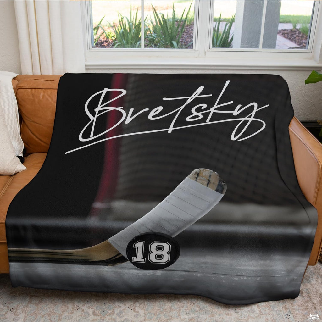 Ice hockey goal crease sports blanket styled across bedroom bed