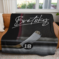 Ice hockey goal crease sports blanket styled across bedroom bed