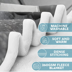 Close-up perspective of taped hockey stick blades on throw blanket