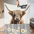 Rustic daisy fence Highland cow throw blanket featuring shaggy cow over wooden fence with daisies