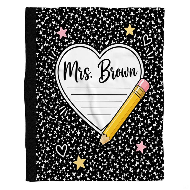 Notepad heart and pencil teacher throw blanket draped casually over a living room couch