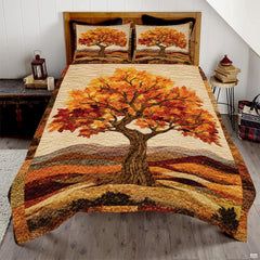 Golden autumn tree and maple leaf bedding set featuring an ornate woodland tree and pumpkin patchwork in amber tones.