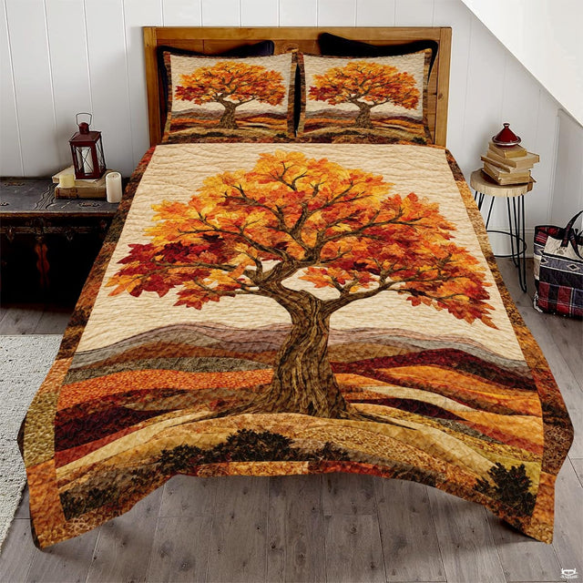 Golden autumn tree and maple leaf bedding set featuring an ornate woodland tree and pumpkin patchwork in amber tones.