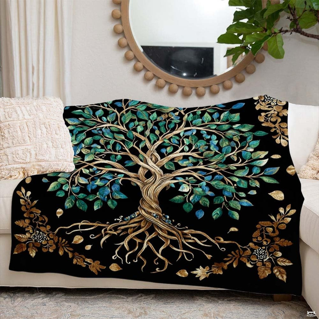 Living room decor setting featuring gold tree and teal foliage throw blanket