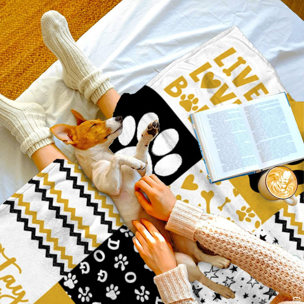 Golden dog paw print throw blanket view 2 highlighting patchwork pattern squares, bones, and stripes