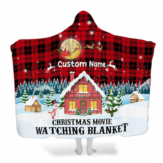 Holiday Christmas village cottage throw blanket with snow-covered brick house and red buffalo plaid