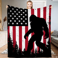 Bigfoot sasquatch american flag forest blanket held upright by model