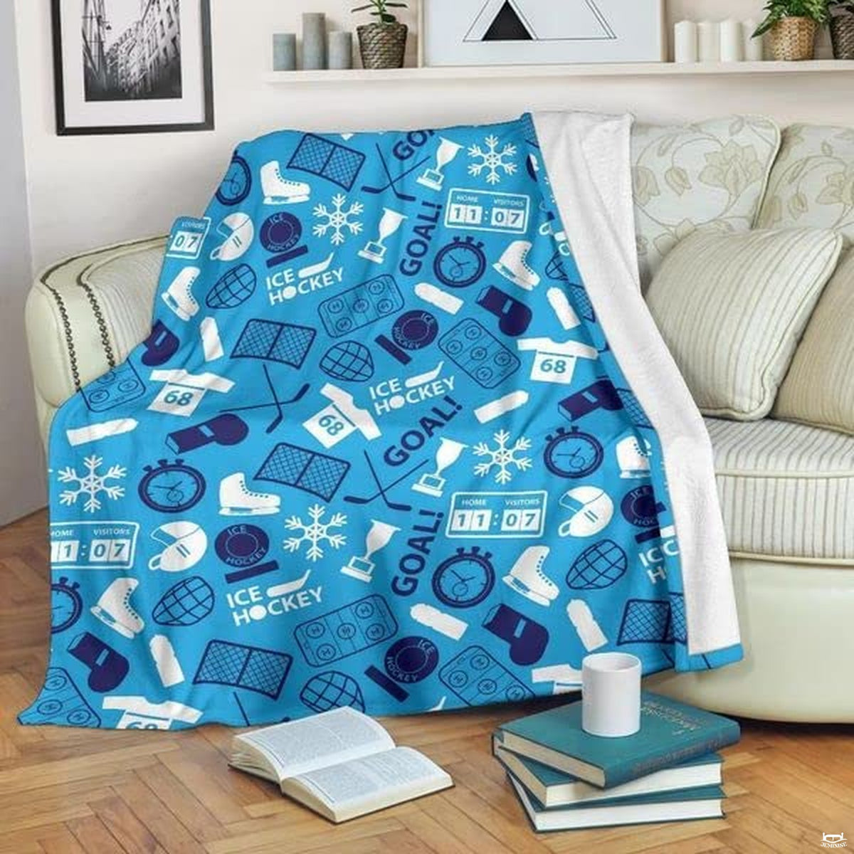 Turquoise ice arena sports equipment blanket draped across sofa with books