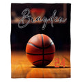 Basketball on hardwood court sports throw blanket showing ball on gym floorboards