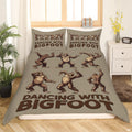 Dancing Bigfoot Sasquatch rustic woodland bedding set displayed on a bed in a cabin bedroom
