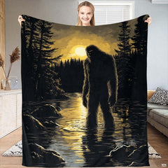 Bigfoot silhouette standing in calm lake waters under a radiant golden pine forest sunset.