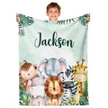 Full view of watercolor safari jungle animals nursery blanket held up indoors.