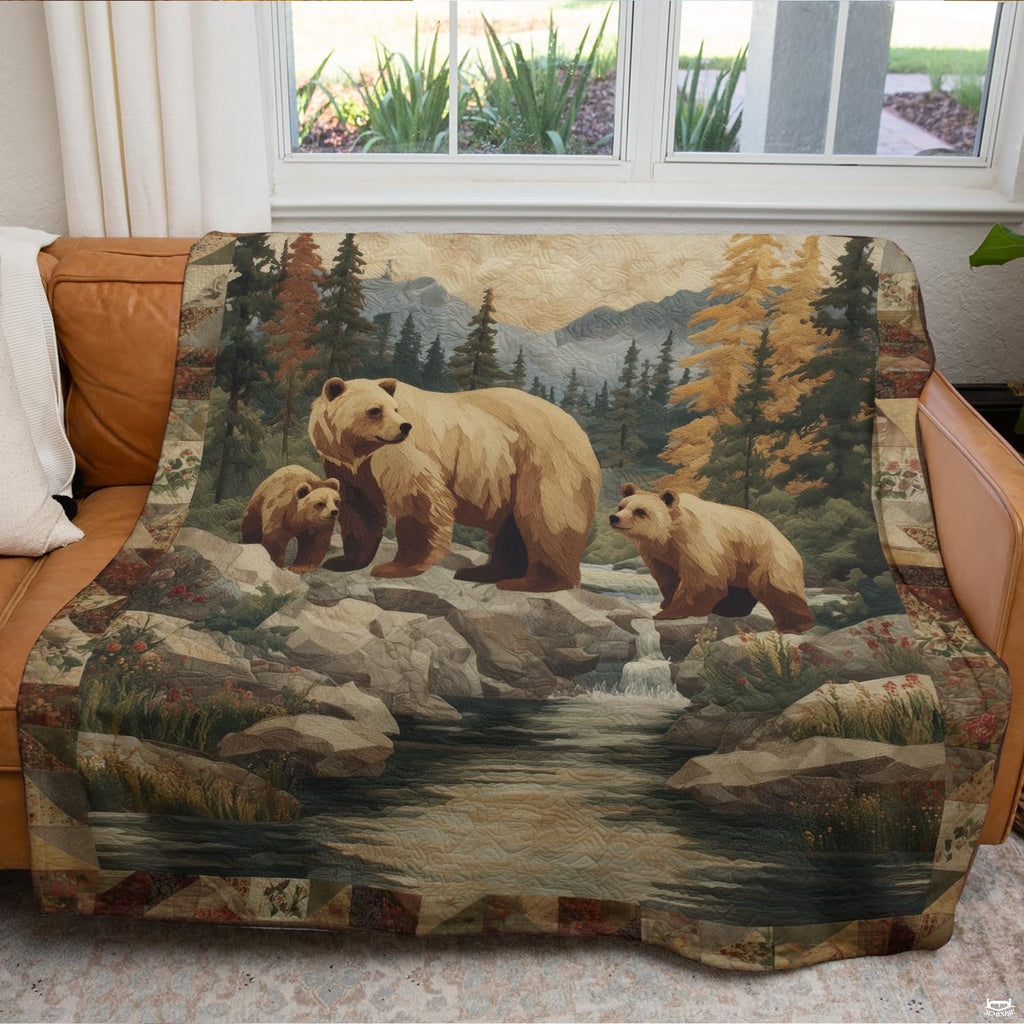 Rustic bear family throw blanket draped over leather sofa in cabin living room
