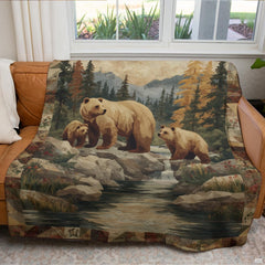 Rustic bear family throw blanket draped over leather sofa in cabin living room