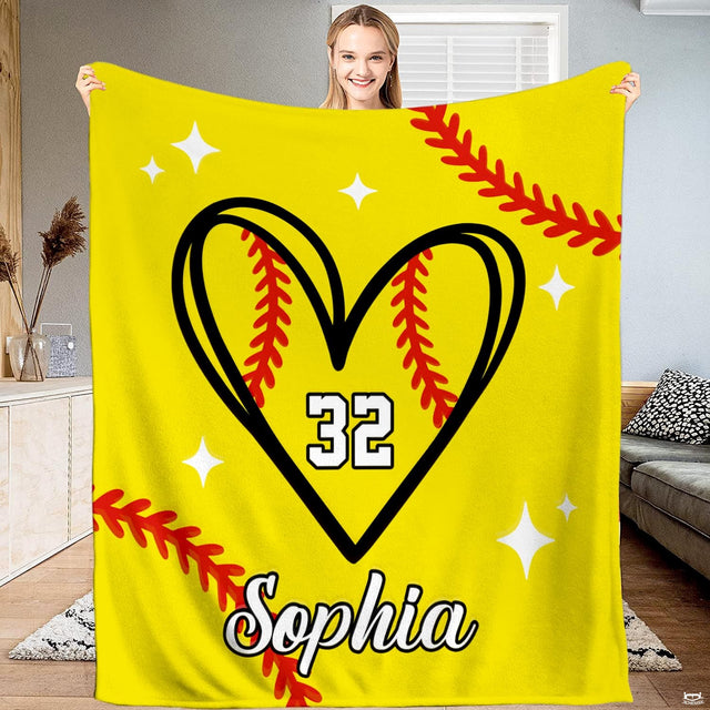 Front view of softball heart throw blanket displaying black heart outline, red seams, and yellow field.