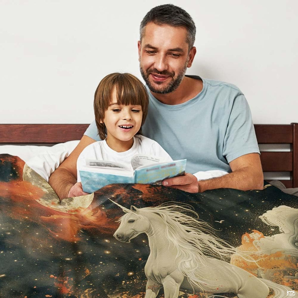 Folded corner presentation of celestial full moon unicorn blanket showing vivid colors