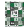 Woodland deer baby blanket displayed flat showing green rustic patchwork squares and stag silhouettes