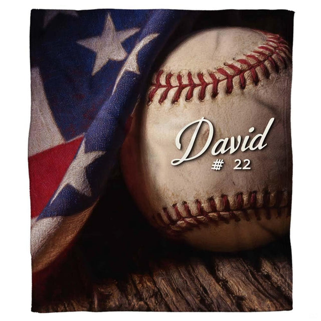 Patriotic baseball and American flag bedding set against dark rustic wood textures.