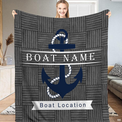 Nautical navy anchor rustic wood throw blanket featuring a blue anchor over grey wood parquet planks