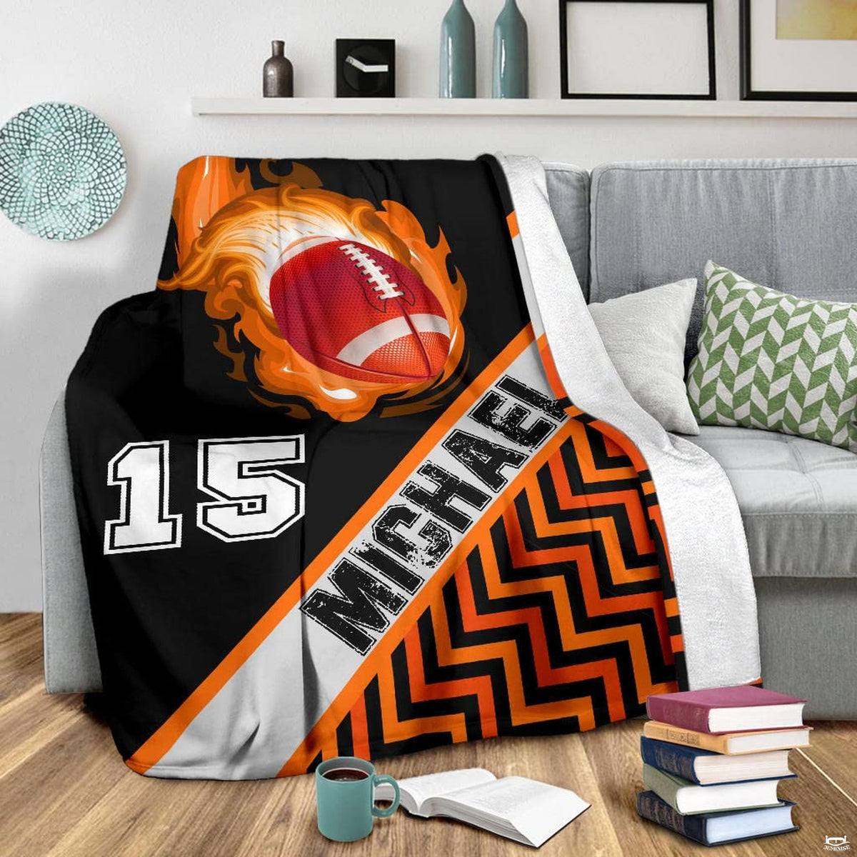 Blazing football graphic blanket styled across bedroom bed