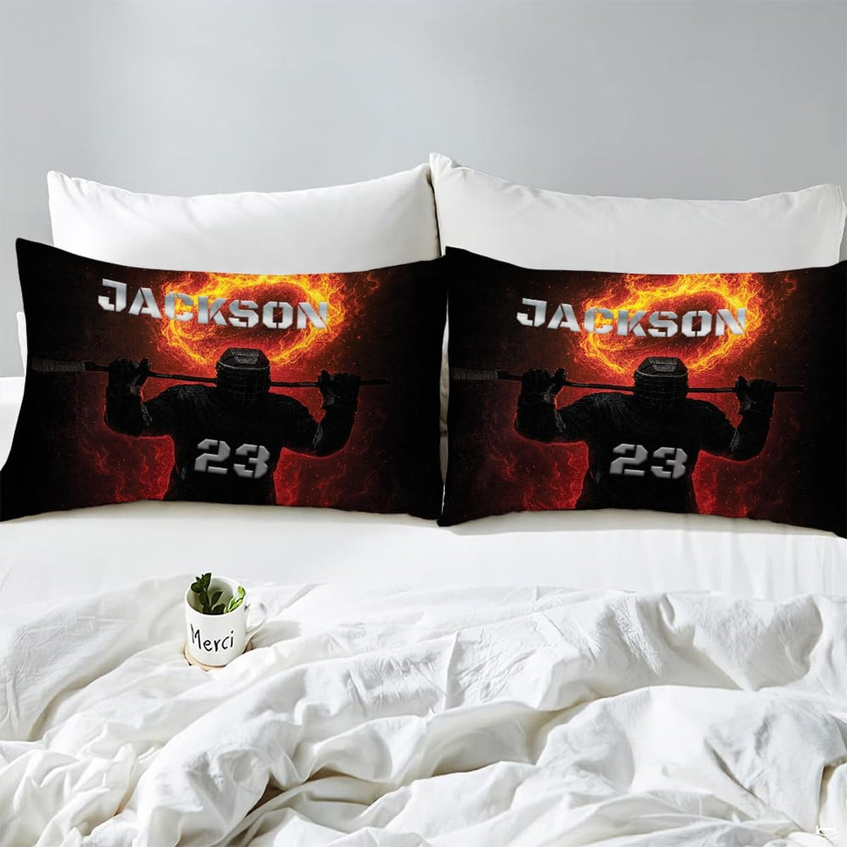 Side angle view of athletic winter sports bedding showing amber orange and midnight black tones on mattress