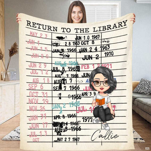 Model holding up the vintage library due date card throw blanket in a bright living space.