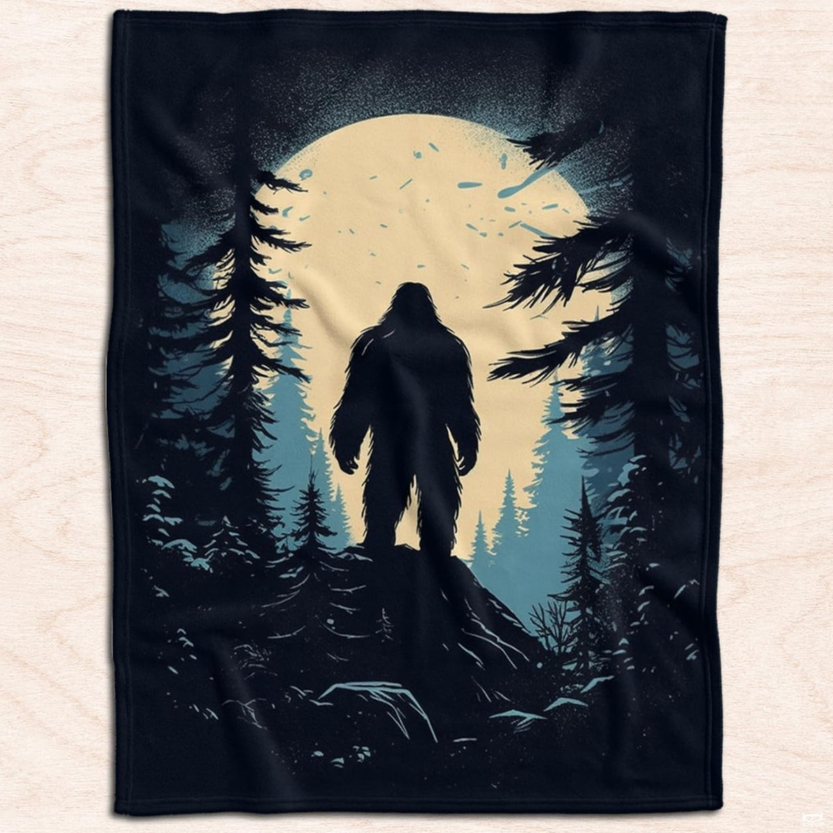 Sasquatch rocky ridge throw blanket displayed across a bedroom bed.