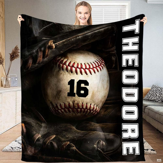 Baseball resting inside a dark fielder glove beside vertical white varsity lettering, view 2.