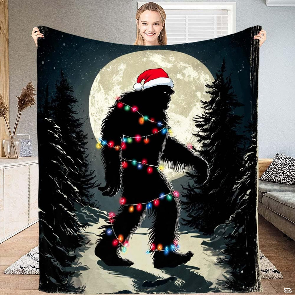 Bigfoot in a Santa hat wrapped in colorful Christmas lights under a full moon, view 1.