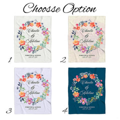 Wedding gift bedsheet presentation highlighting a centered botanical garland with colorful watercolor flowers.