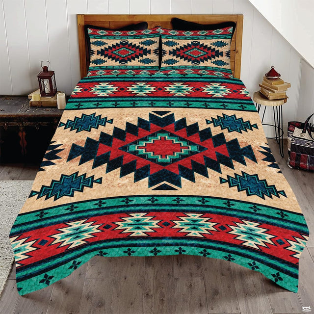Boho geometric bedding showcasing central Southwestern Aztec diamond medallion in turquoise and rustic red.