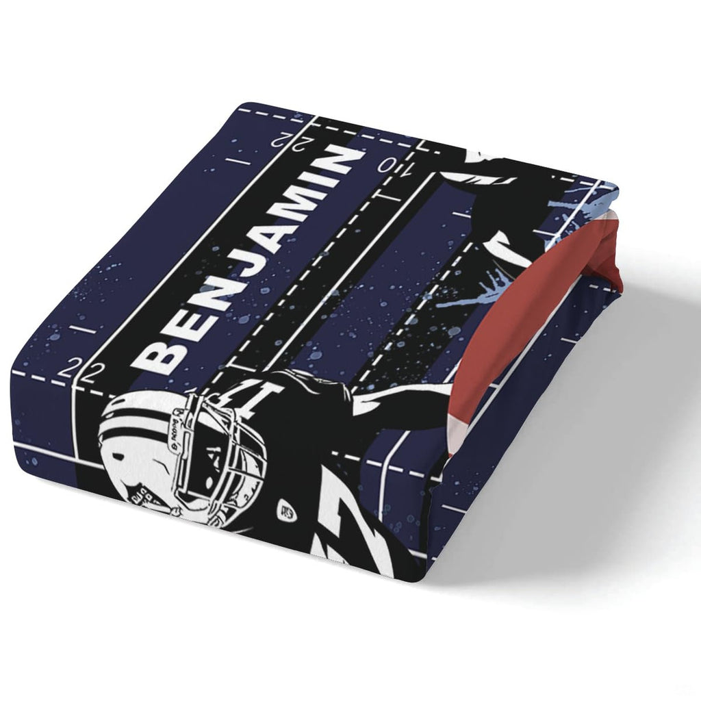 Corner perspective of athletic football bedding highlighting crisp playbook printing against navy background
