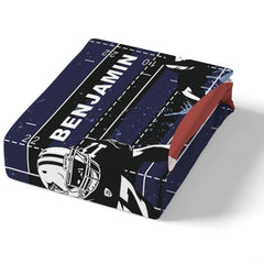 Corner perspective of athletic football bedding highlighting crisp playbook printing against navy background