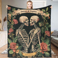 Gothic skeleton couple roses throw blanket featuring two embracing skeletons and vintage floral banners
