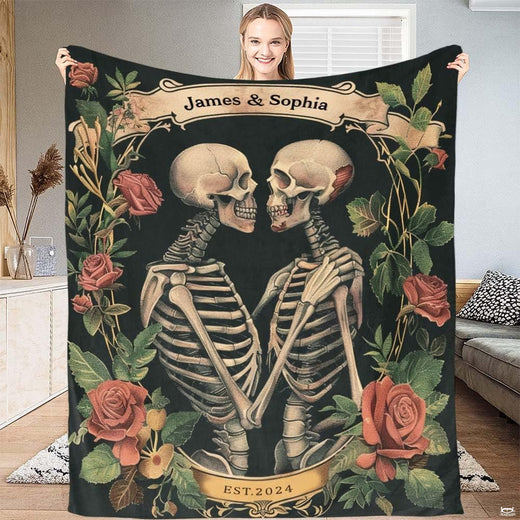 Gothic skeleton couple roses throw blanket featuring two embracing skeletons and vintage floral banners