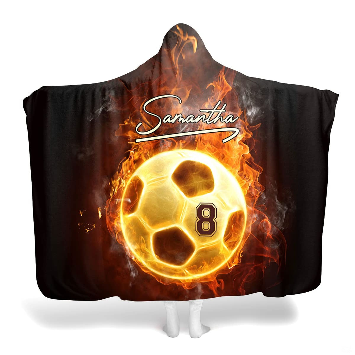 Fire soccer ball blanket displaying a glowing flame soccer ball with athletic script on midnight black backdrop.