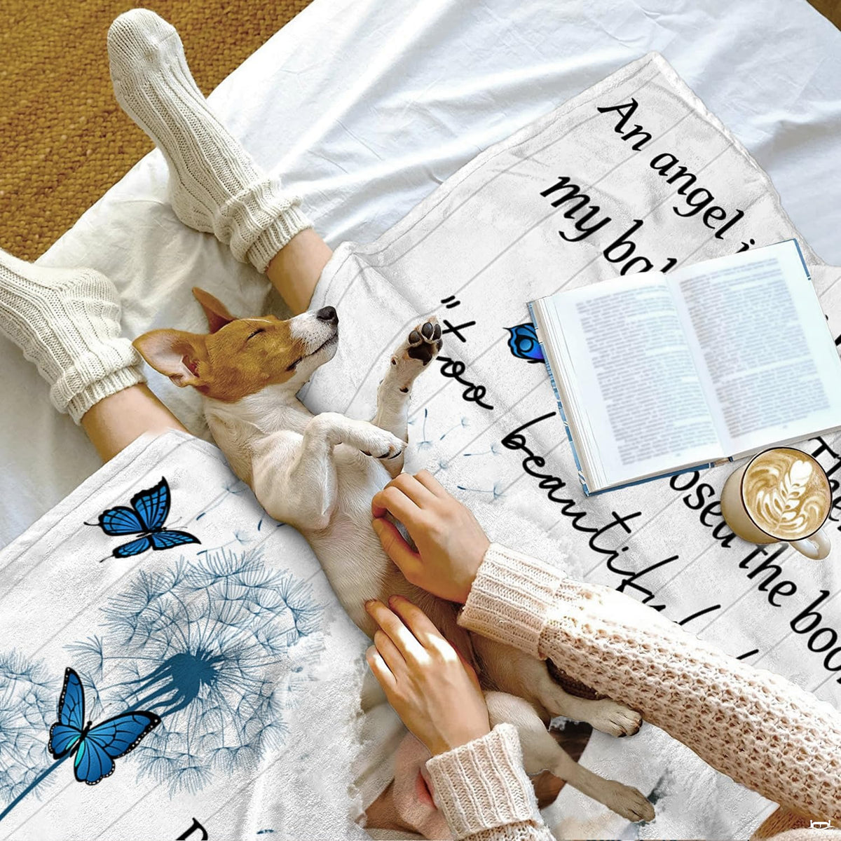 Blue butterflies throw blanket featuring dandelion seeds and heart frame on white wood background.
