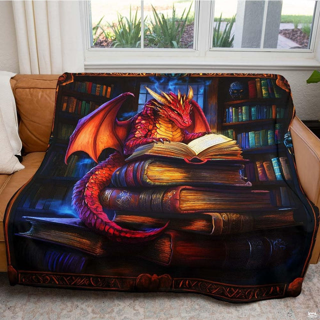Living room sofa displaying the fantasy red dragon library book throw blanket.