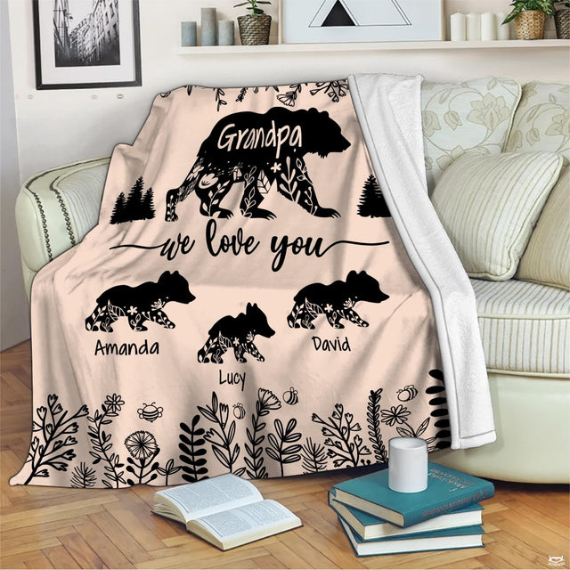 Living room display showing rustic woodland bear throw blanket styled on modern furniture.
