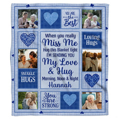 Close view of inspirational quote card and blue textured mosaic heart on collage throw blanket