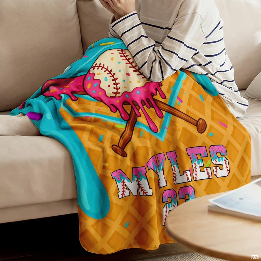 Close view of melting ice cream baseball scoop and crossed frosted bats on blanket