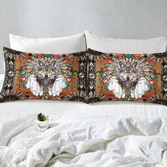 Close pillows with centered wolf, colored feather tips, and geometric borders